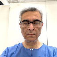 A man with short grey hair