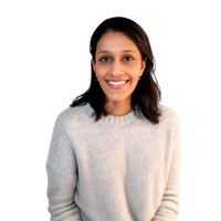 A woman with brow hair smiling