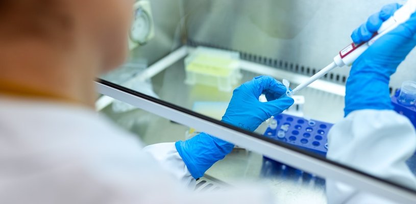 Researcher with pipette