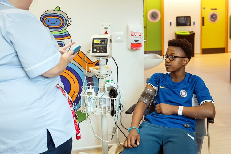 A Young Person having their blood pressure measured at the NIHR GOSH CRF