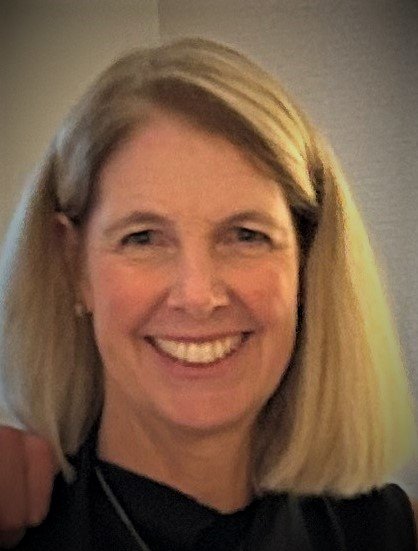 An image of a staff member smiling