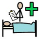 A patient laying in a hospital bed with a clinician standing next to them pointing to a clipboard