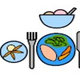 Two plates with food and a knife and fork