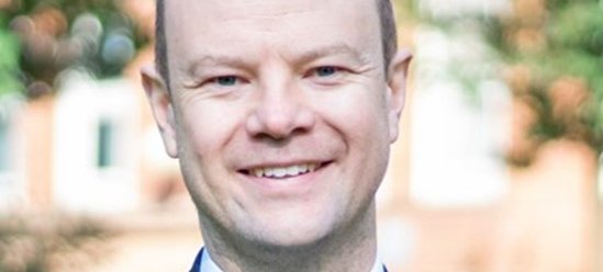 Aa man smiling at the camera