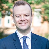 Aa man smiling at the camera