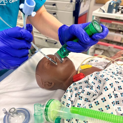 A manakin of a child with a tube going in to its mouth