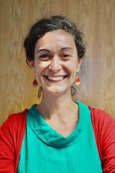 A woman smiling at the camera.