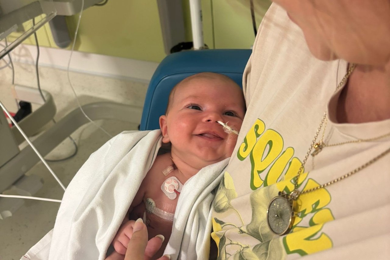 A small baby is smiling