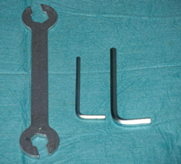 A spanner and two allen key tools