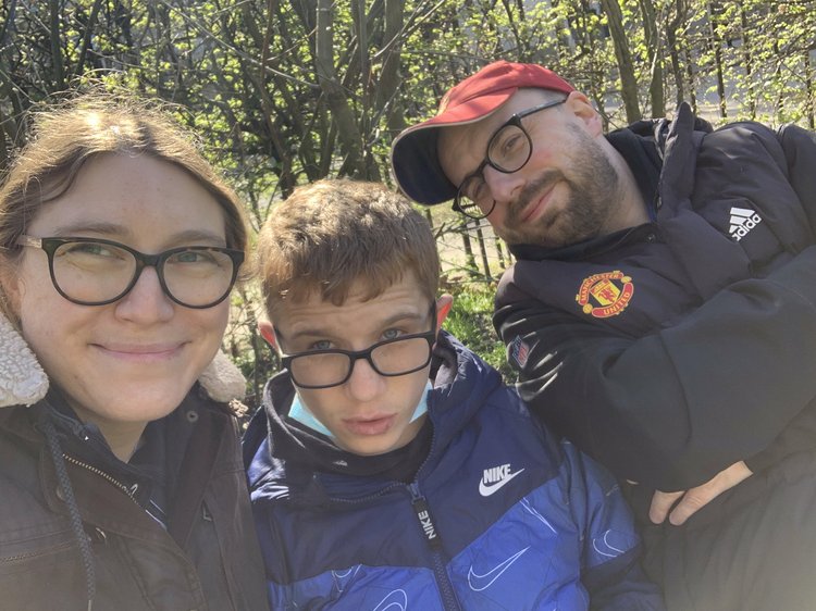 Will sitting in between his mum and dad