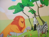 A drawing shows a lion and zebra with a tress behind them