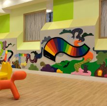 Colorfully decorated walls and children's chairs in the lobby of Somers Clinical Research Facility