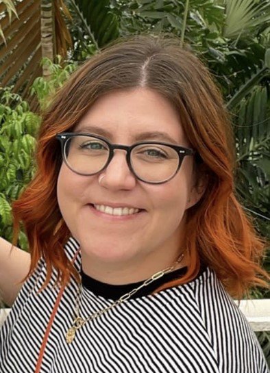 An image of a staff member smiling